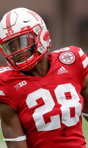 Nebraska RB Washington faces charges tied to assault video
